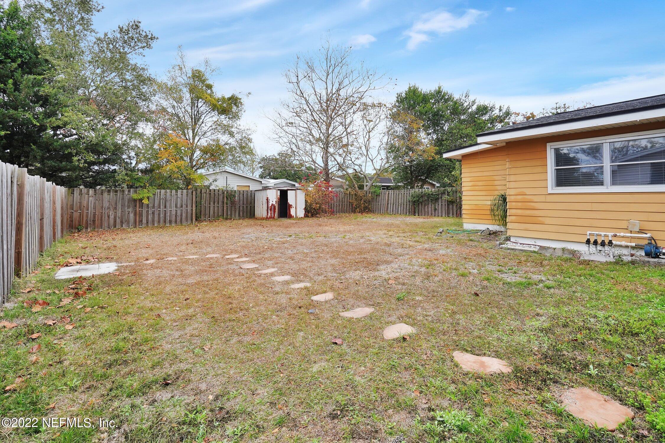 208 Baracoa Court St. Augustine, FL 32086 - Photo 28 of 32 a backyard of a house with lots of green space