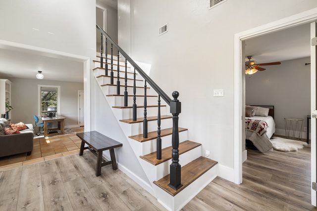 a view of entryway livingroom and hall with wooden floor