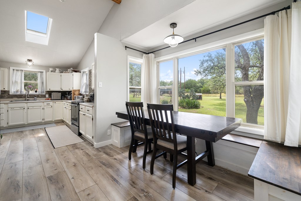 396 Ranch Road 2721 Johnson City, TX 78636 - Photo 2 of 36 a view of a dining room with furniture window and wooden floor