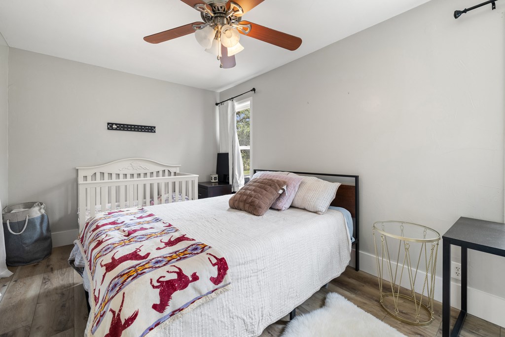 396 Ranch Road 2721 Johnson City, TX 78636 - Photo 23 of 36 a bedroom with a bed and a window