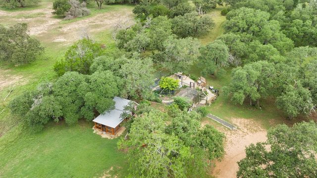 a aerial view of a house with a yard