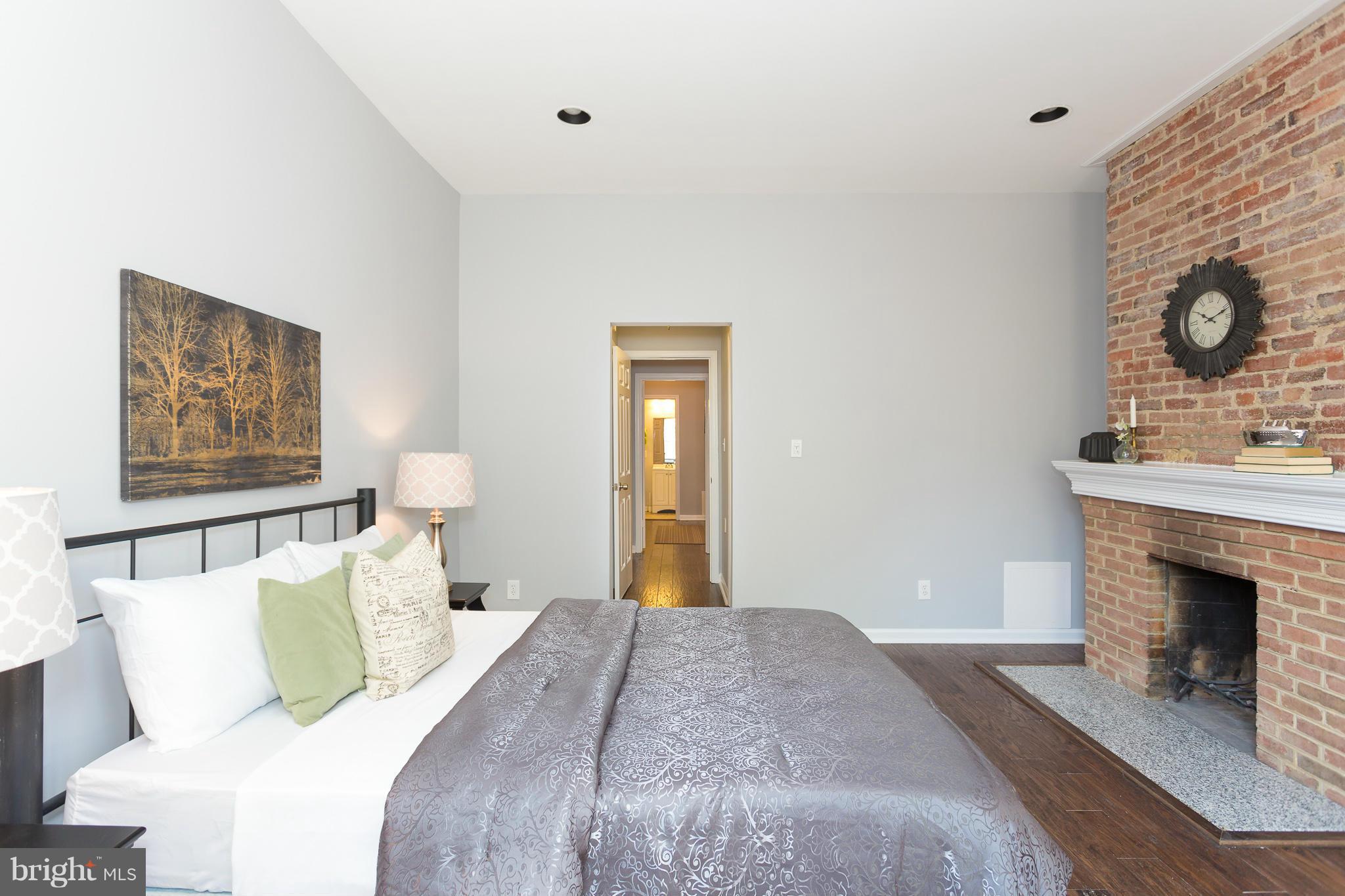 1625 S Street Northwest, Unit 1 Washington, DC 20009 - Photo 21 of 30 Master bedroom with fireplace
