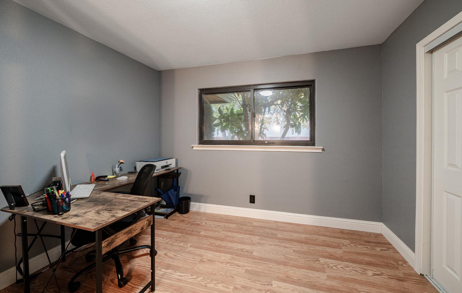 27152 Perkins Road Madera, CA 93637 - Photo 16 of 25 a view of a workspace with furniture and a window
