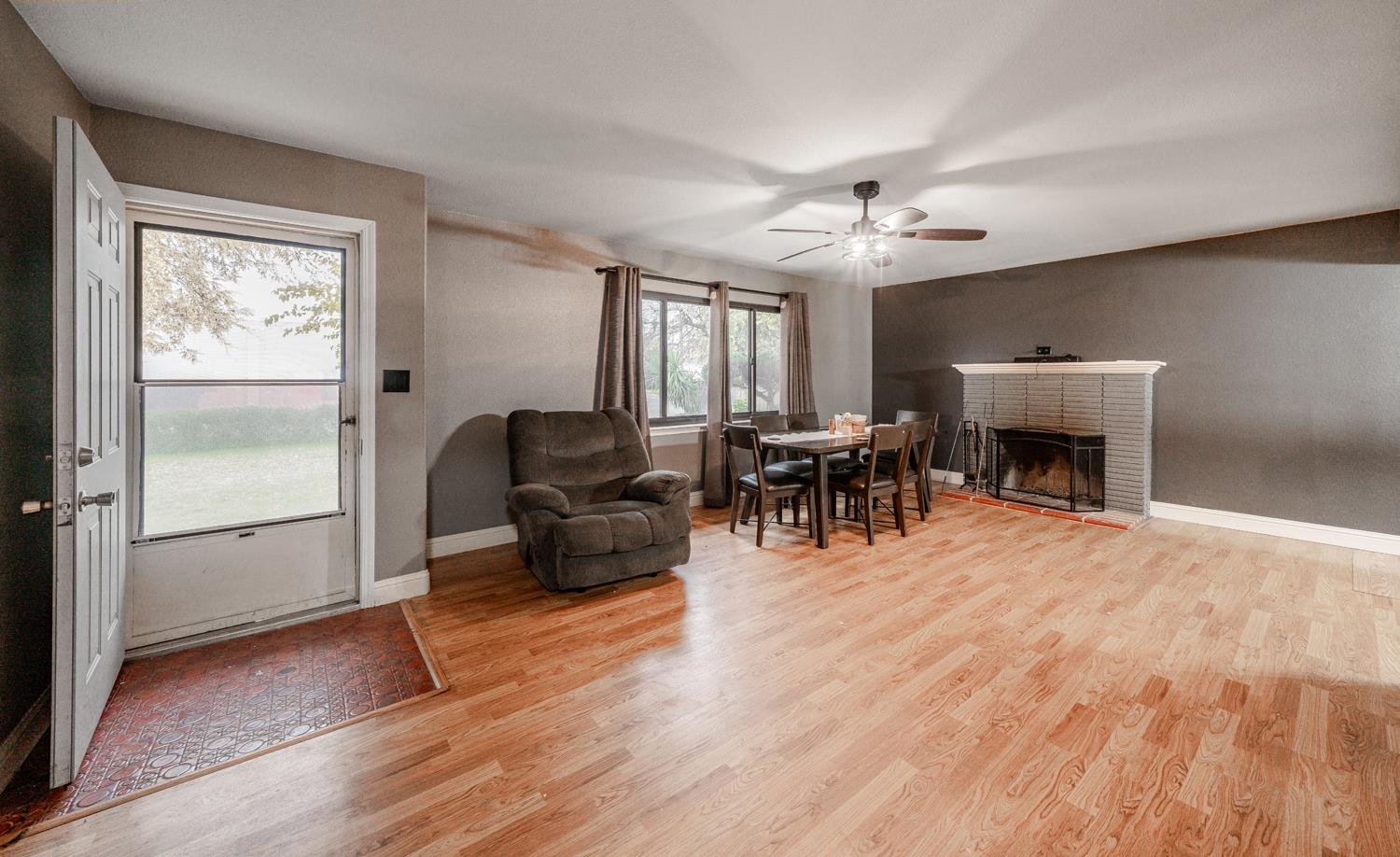 27152 Perkins Road Madera, CA 93637 - Photo 6 of 25 a living room with furniture and a fireplace
