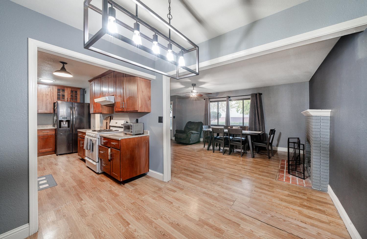 27152 Perkins Road Madera, CA 93637 - Photo 8 of 25 a kitchen with lots of counter top space and stainless steel appliances