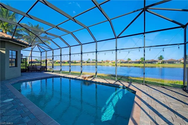 a view of a kitchen with a sink and wooden floor