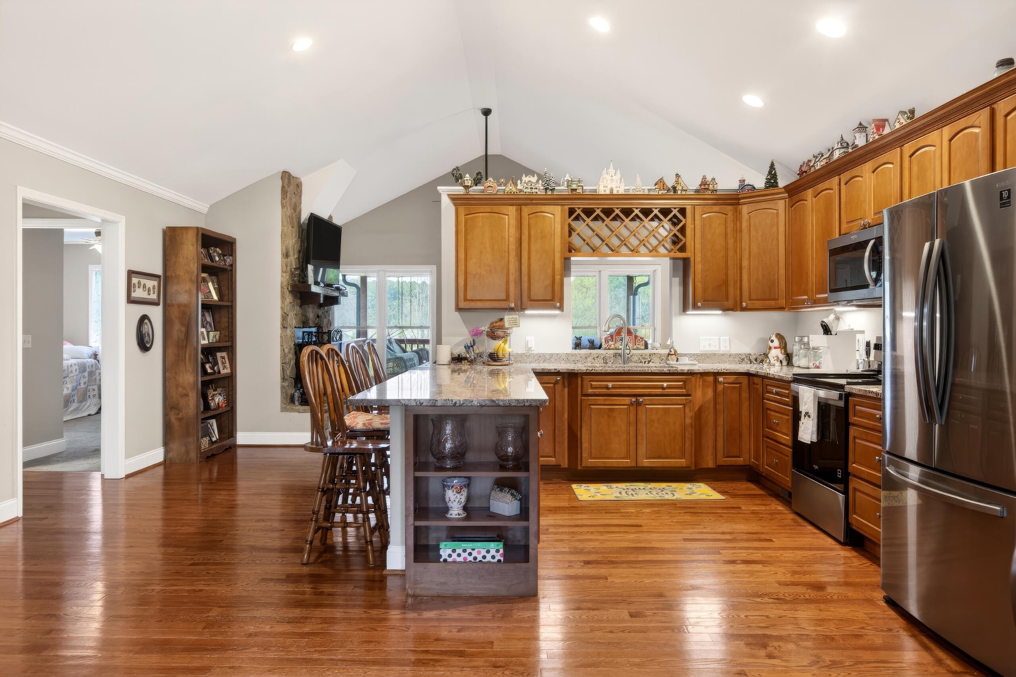 2181 Curbow Bridge Road Old Fort, TN 37362 - Photo 13 of 56 a kitchen with stainless steel appliances granite countertop a refrigerator a stove top oven a dining table and chairs