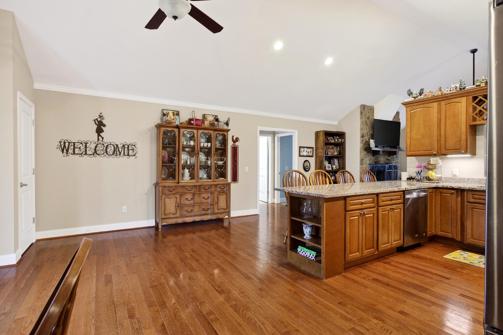 2181 Curbow Bridge Road Old Fort, TN 37362 - Photo 16 of 56 a kitchen with stainless steel appliances wooden floors and view living room