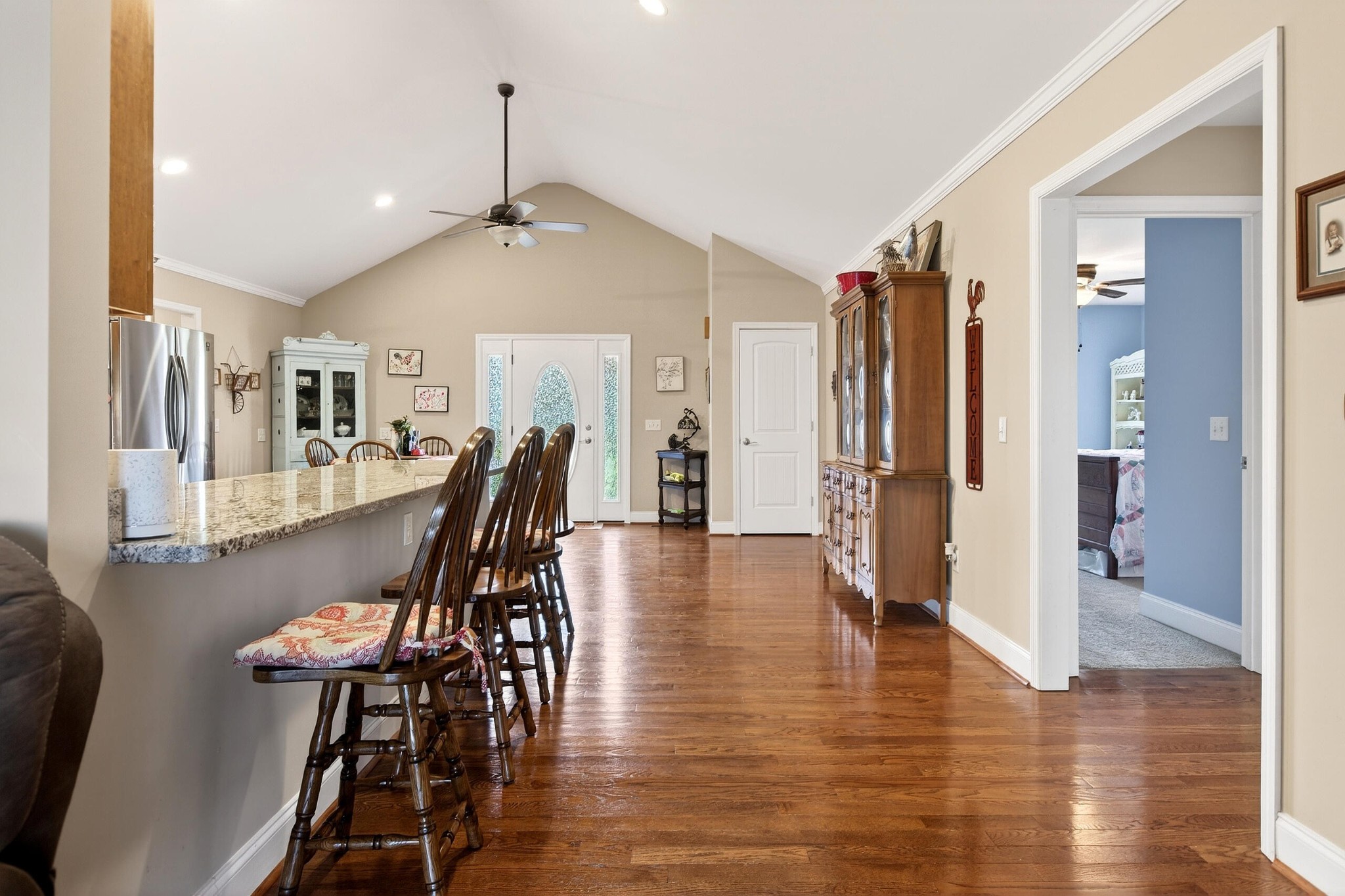 2181 Curbow Bridge Road Old Fort, TN 37362 - Photo 17 of 56 a dining room with furniture wooden floor and a chandelier