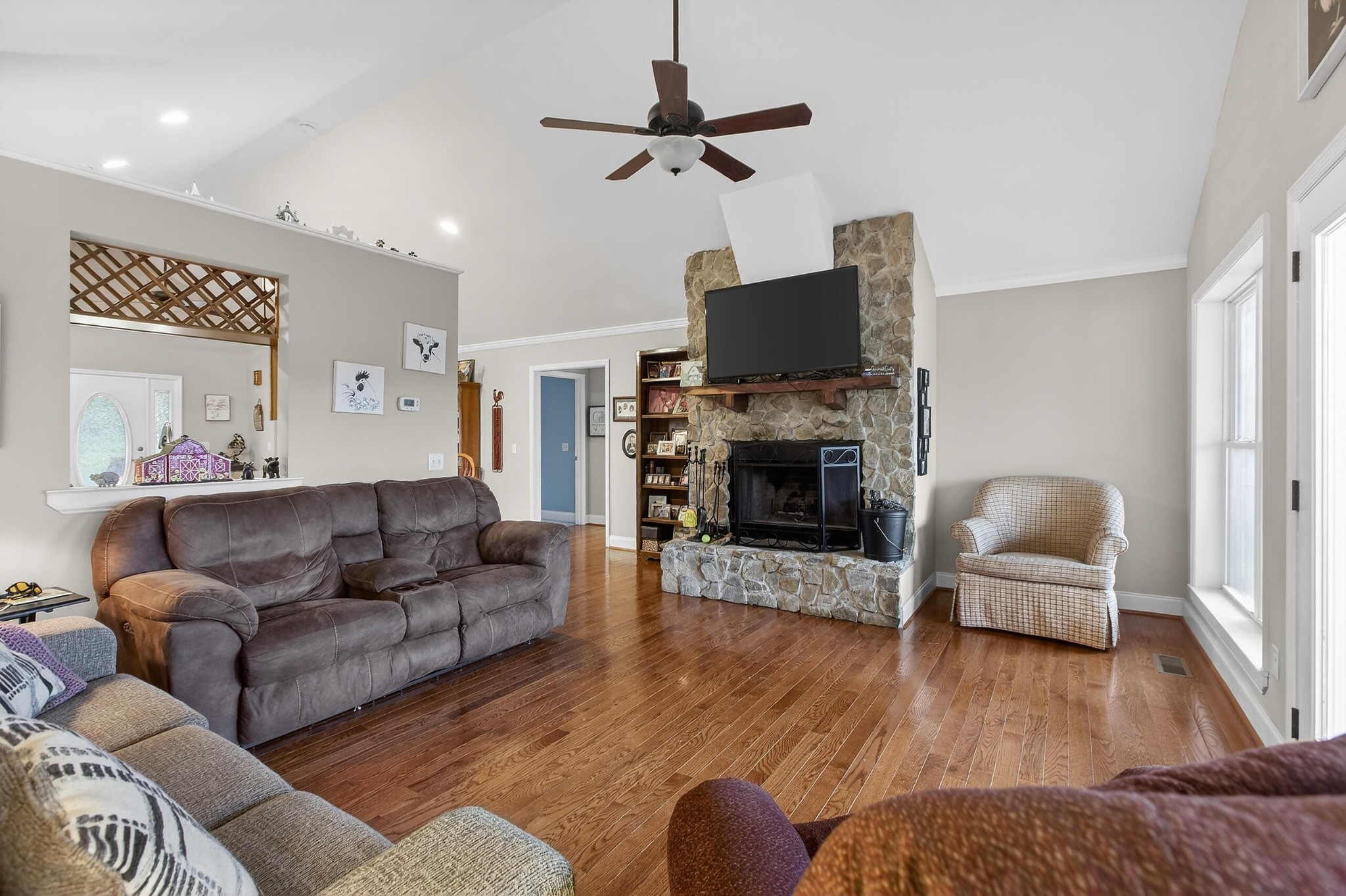 2181 Curbow Bridge Road Old Fort, TN 37362 - Photo 20 of 56 a living room with furniture a flat screen tv and a fireplace
