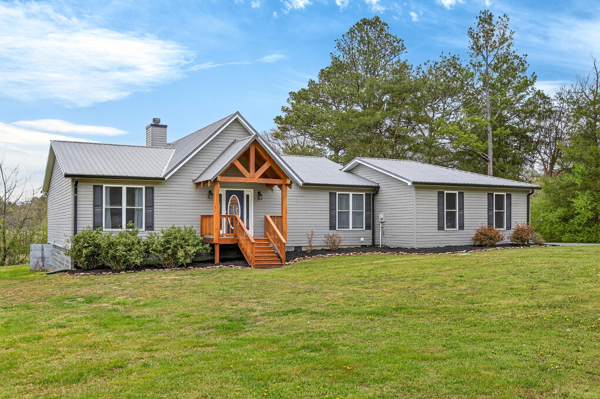 2181 Curbow Bridge Road Old Fort, TN 37362 - Photo 2 of 56 a front view of a house with a yard