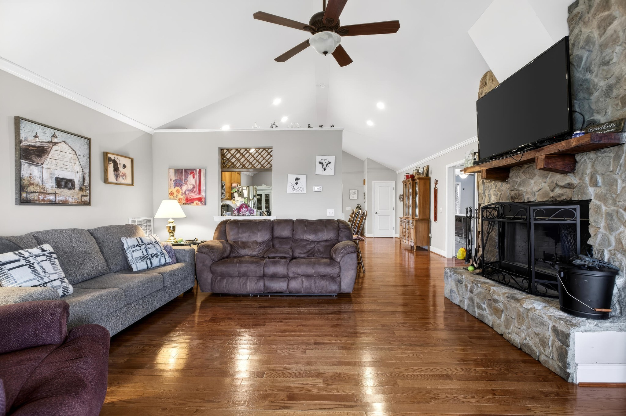 2181 Curbow Bridge Road Old Fort, TN 37362 - Photo 21 of 56 a living room with furniture a flat screen tv and a fireplace