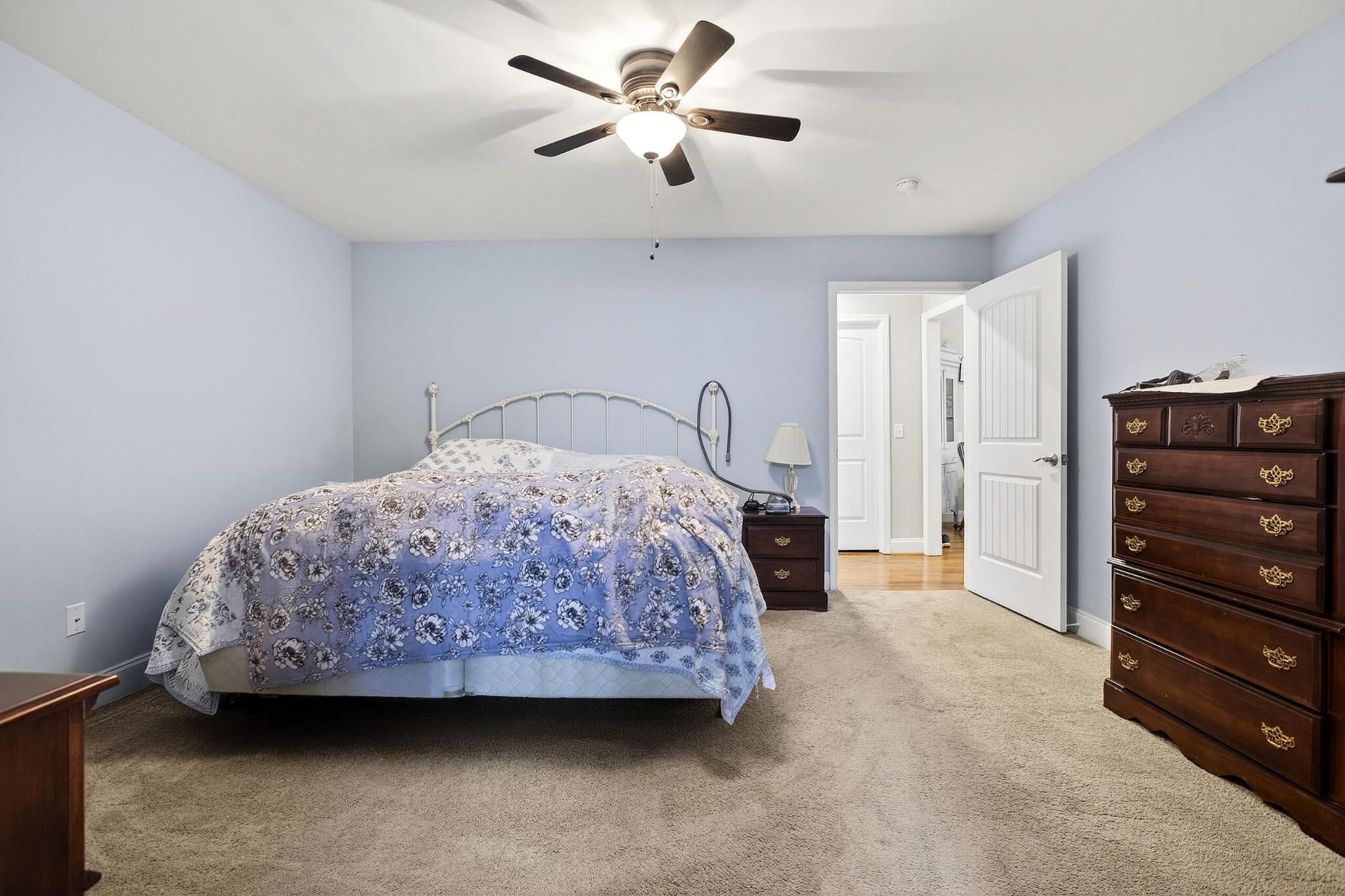 2181 Curbow Bridge Road Old Fort, TN 37362 - Photo 24 of 56 a bedroom with a bed a dresser and a chandelier