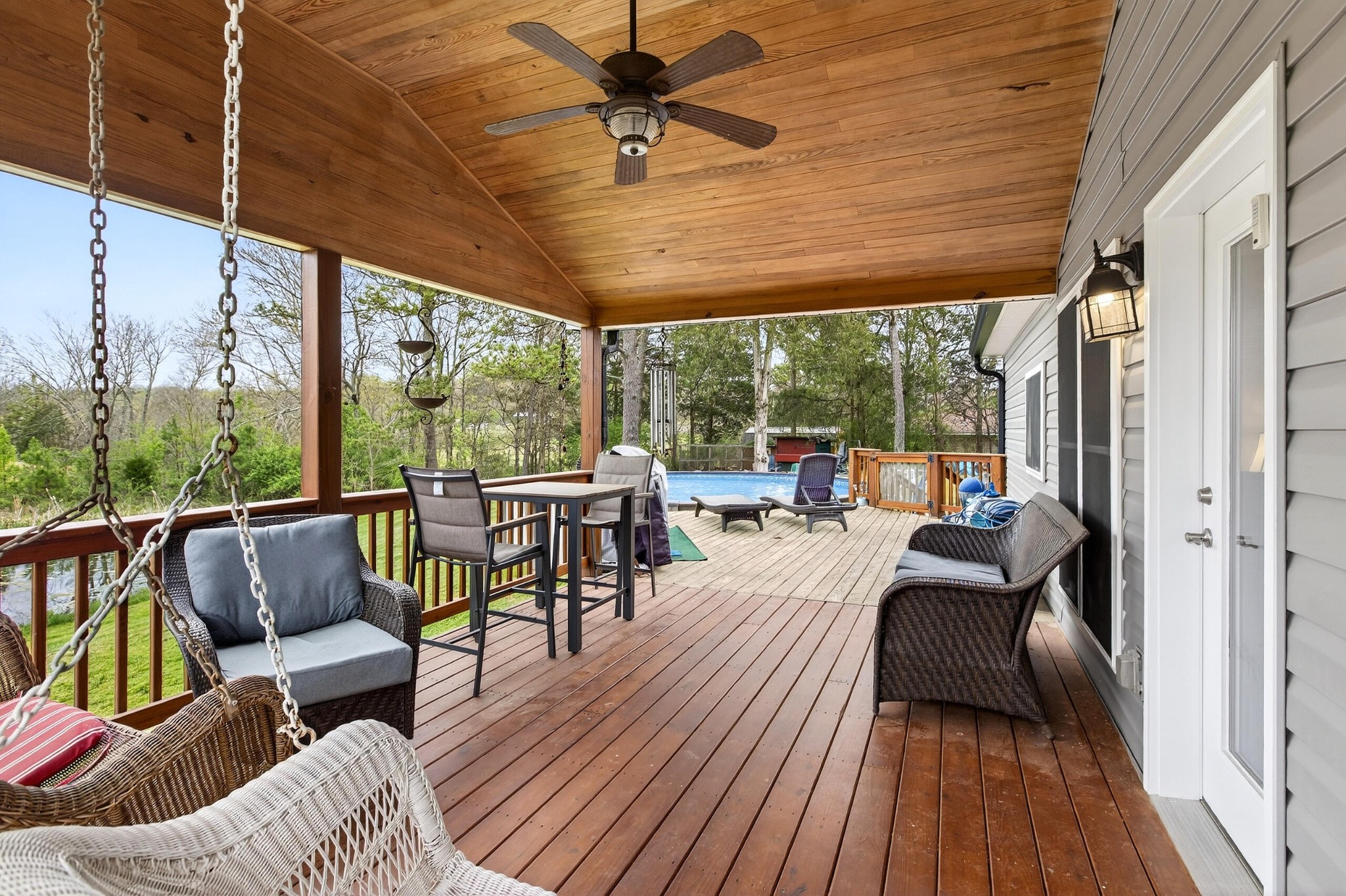 2181 Curbow Bridge Road Old Fort, TN 37362 - Photo 37 of 56 a outdoor space with patio the couches and a dining table with garden view