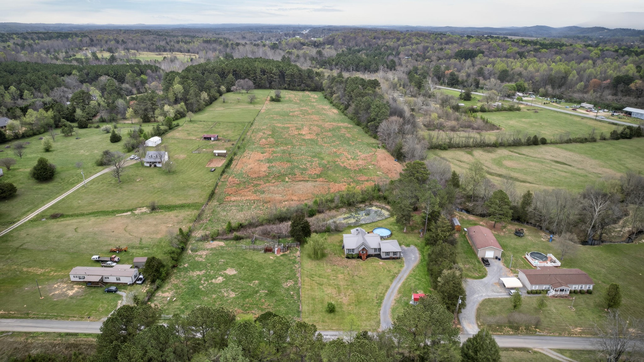 2181 Curbow Bridge Road Old Fort, TN 37362 - Photo 44 of 56 an aerial view of a house with a yard
