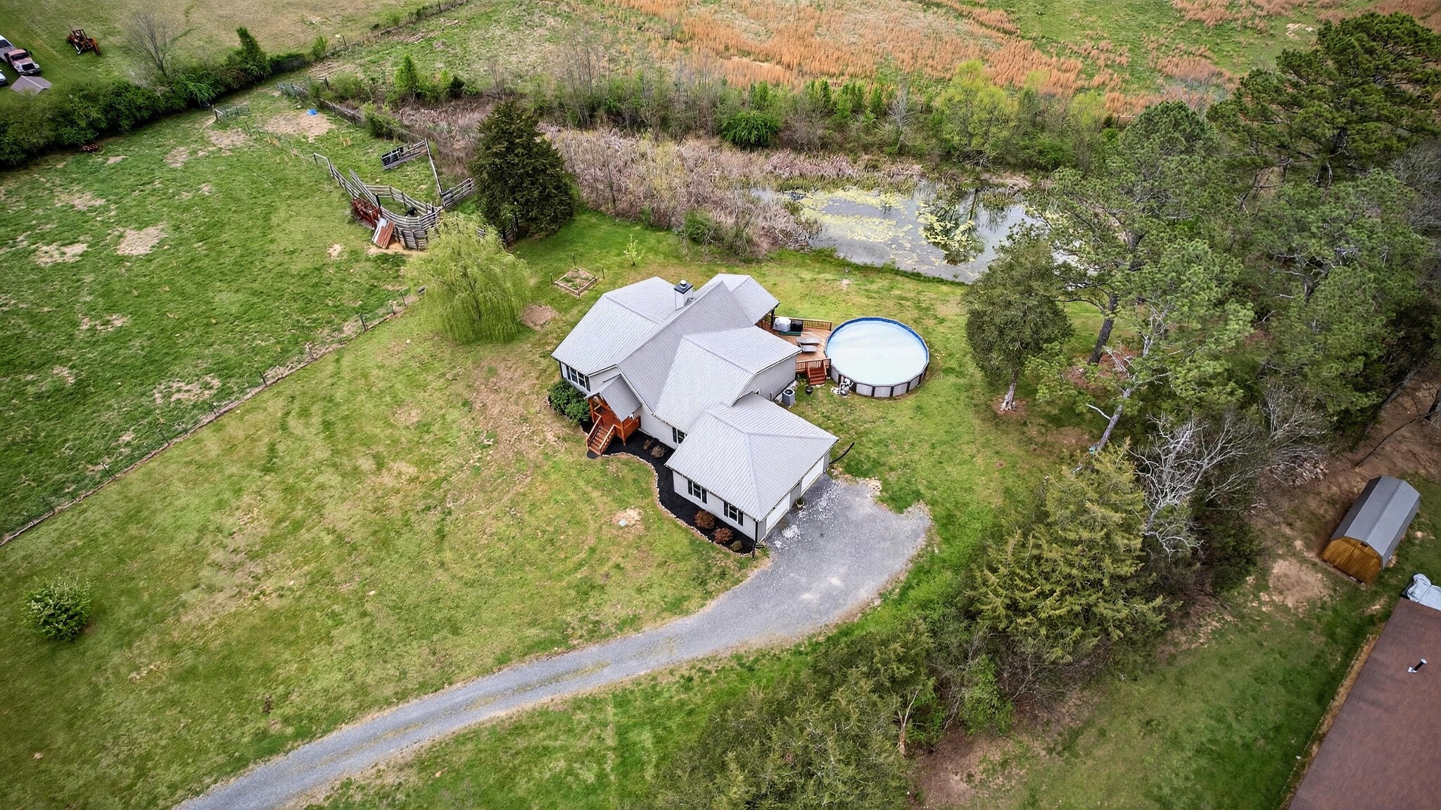 2181 Curbow Bridge Road Old Fort, TN 37362 - Photo 45 of 56 an aerial view of a house with a swimming pool a yard and a garage