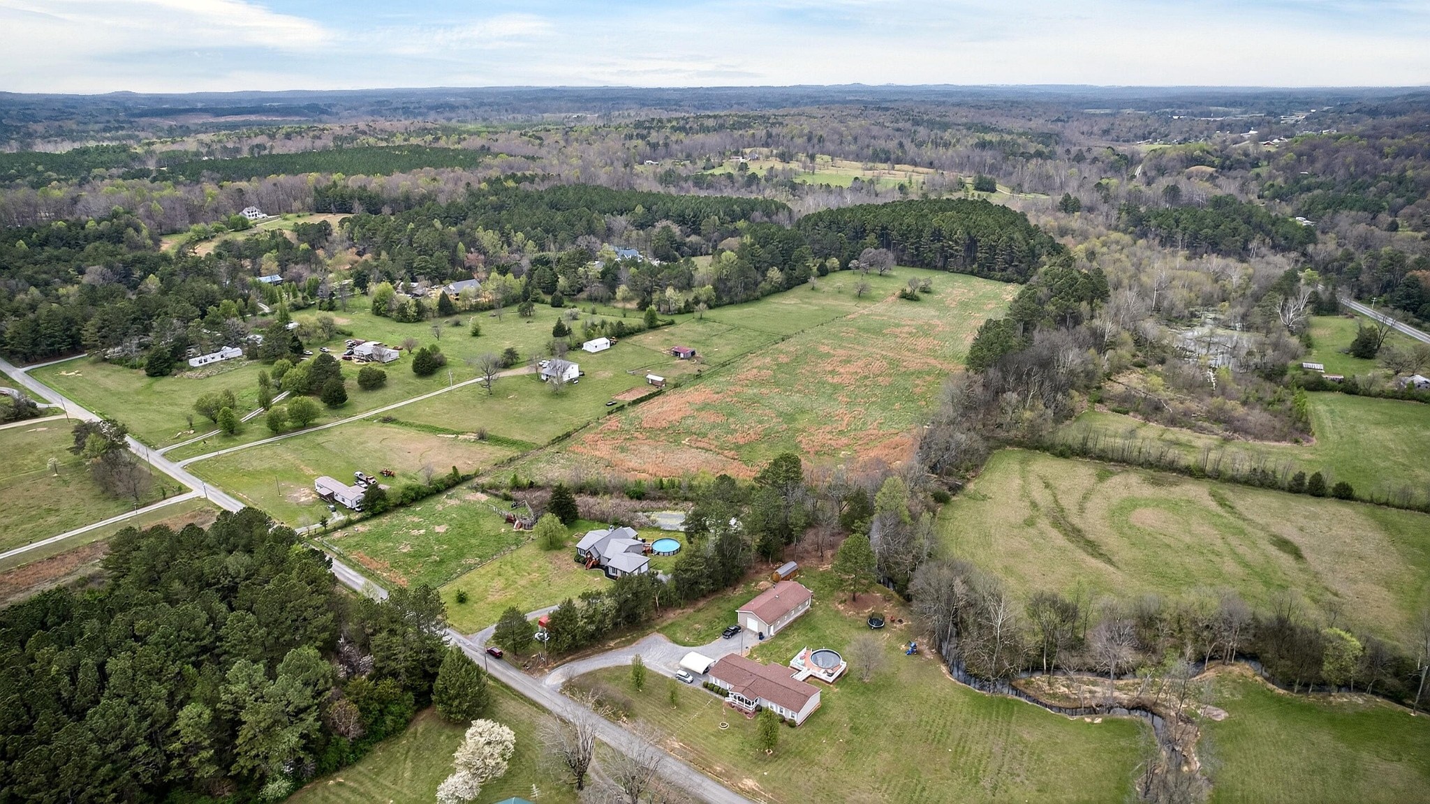 2181 Curbow Bridge Road Old Fort, TN 37362 - Photo 48 of 56 an aerial view of a house with a yard