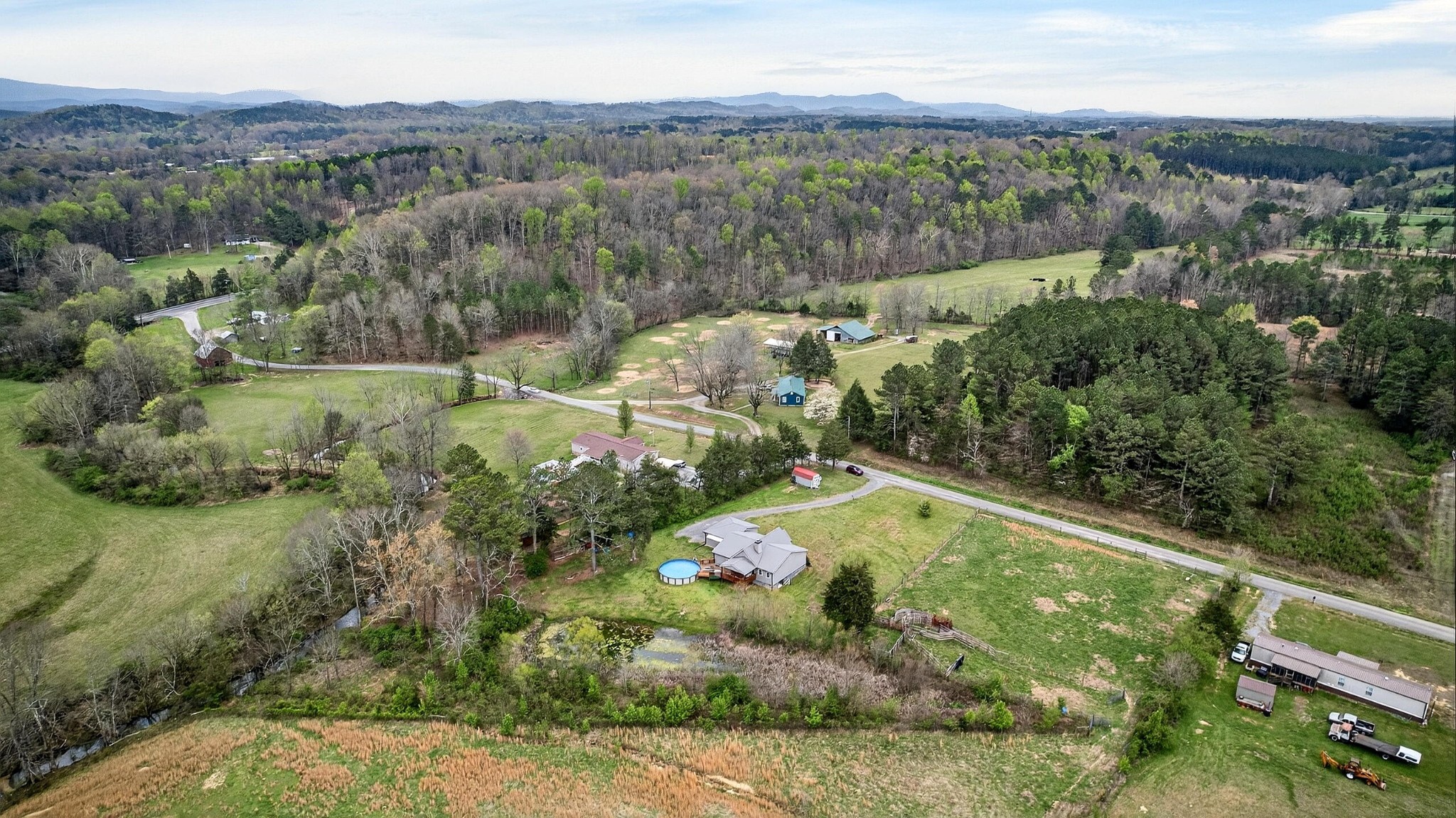 2181 Curbow Bridge Road Old Fort, TN 37362 - Photo 51 of 56 an aerial view of residential houses with outdoor space and trees