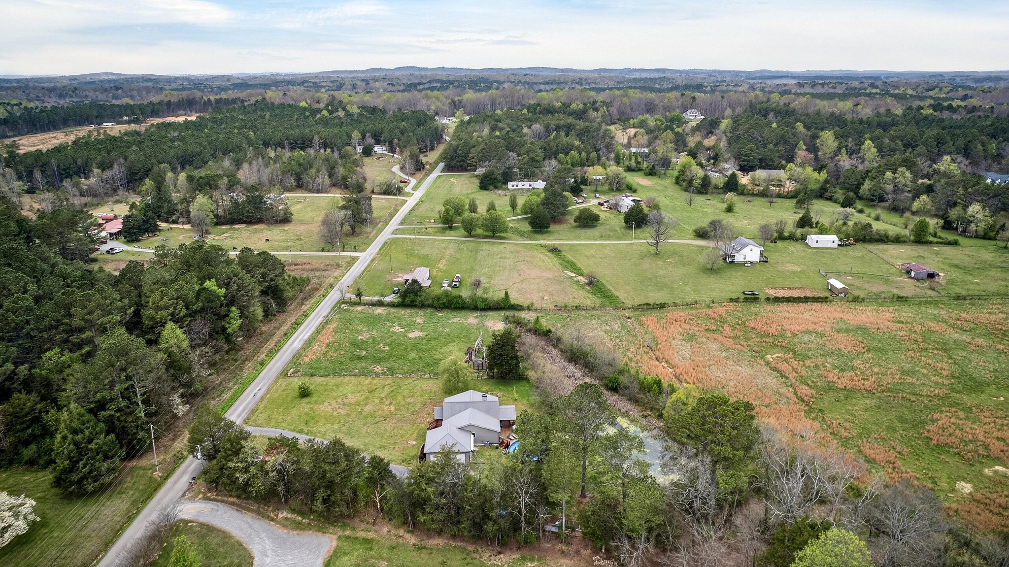 2181 Curbow Bridge Road Old Fort, TN 37362 - Photo 53 of 56 an aerial view of residential houses with outdoor space and trees