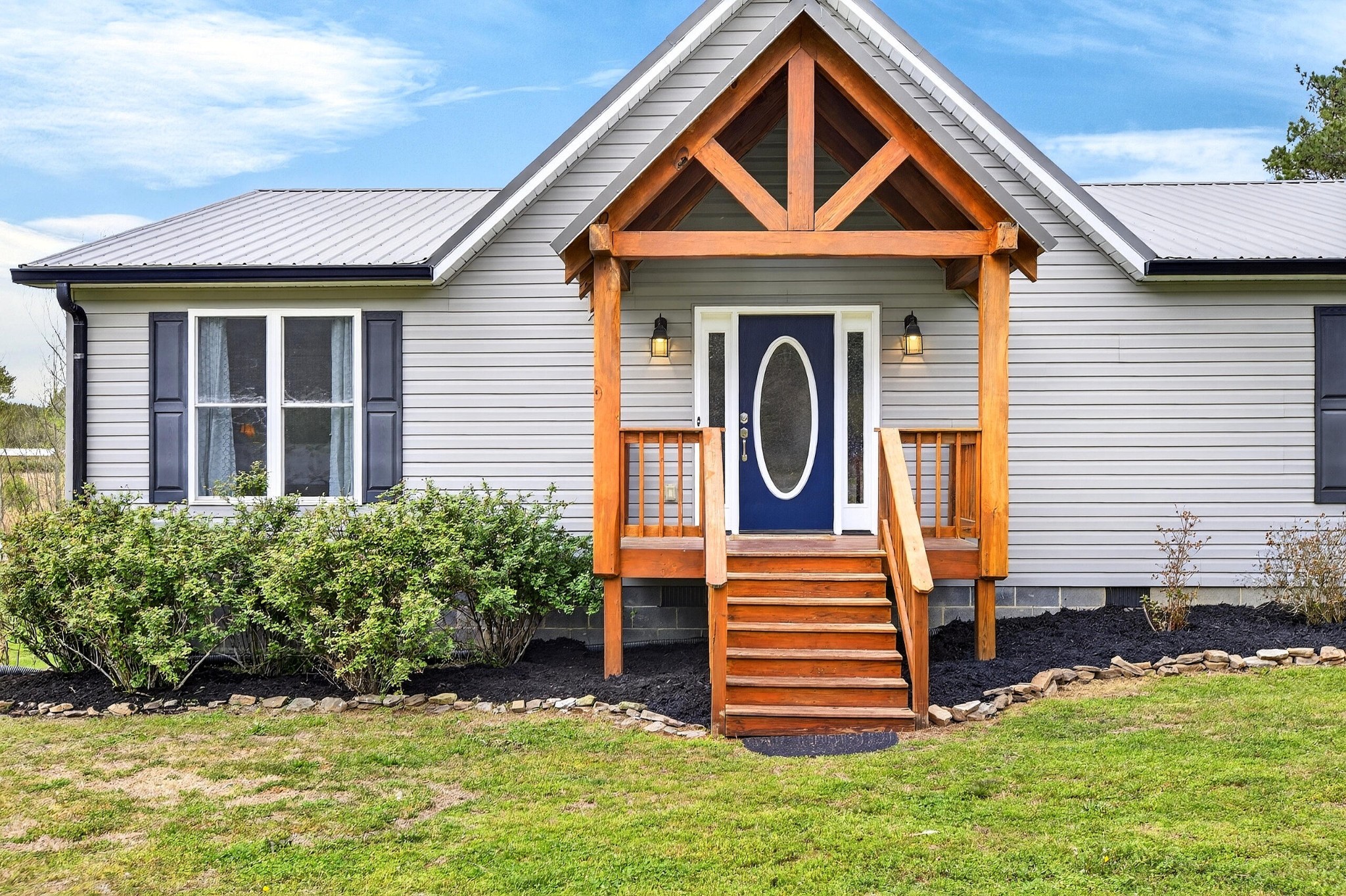 2181 Curbow Bridge Road Old Fort, TN 37362 - Photo 7 of 56 a front view of a house with a yard