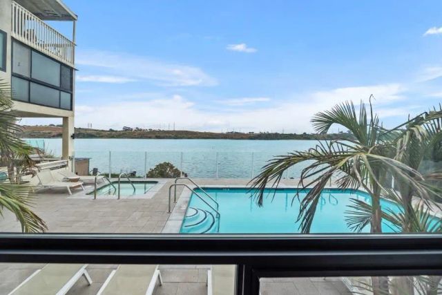 a view of swimming pool from a balcony