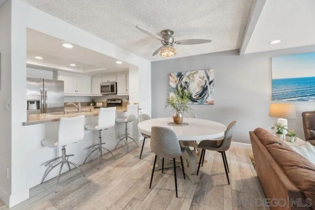a bedroom with furniture and a wooden floor