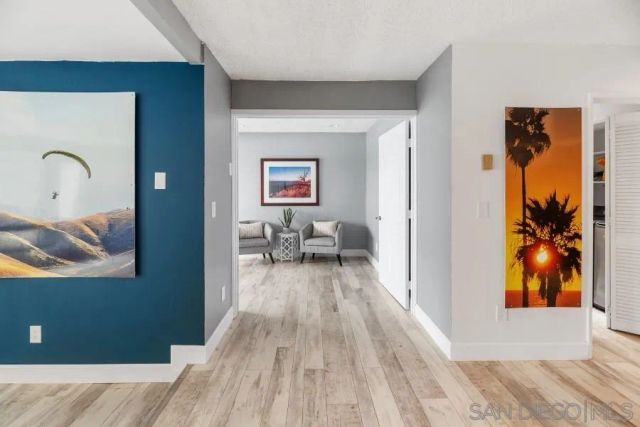 a view of a bathroom with a shower and a window