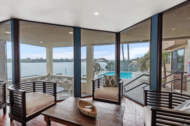 a view of a ocean with a mountain in the background