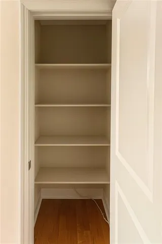 a dining room with furniture a rug and a chandelier