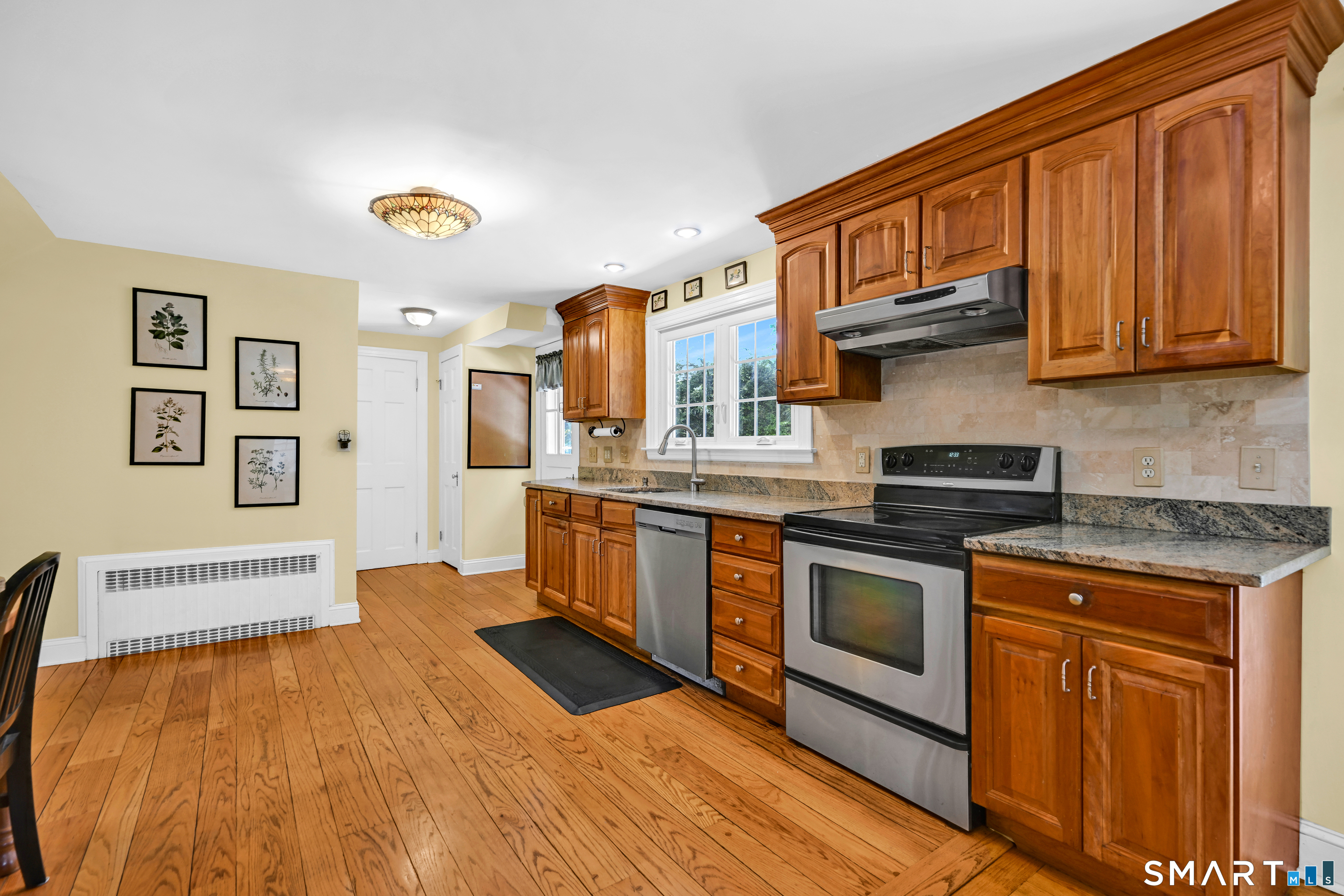 219 Clearfield Road Wethersfield, CT 06109 - Photo 11 of 37 Updated with cherry cabinets, granite countertops and stainless steel appliances