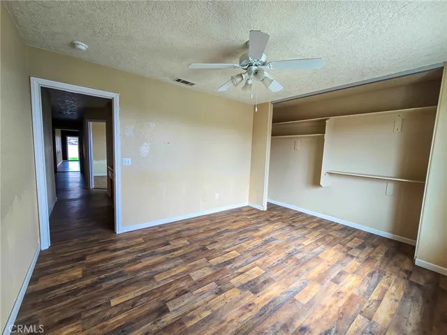 a view of a room window and wooden floor