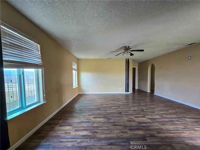 a large spacious bathroom with a granite countertop sink mirror and shower