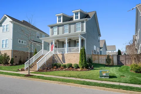 a view of a big building in front of a big yard