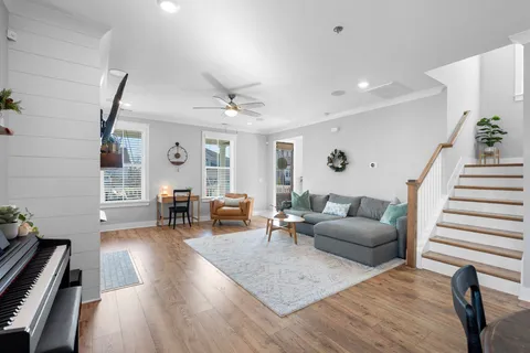 a view of entryway and hall with wooden floor