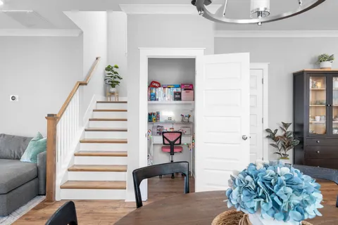 a kitchen with stainless steel appliances granite countertop a stove a refrigerator a kitchen island a sink cabinets and a refrigerator