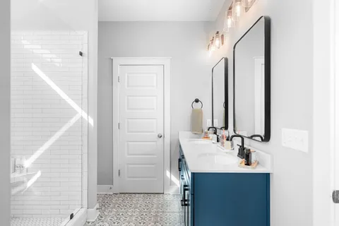 a bathroom with a shower a toilet and sink