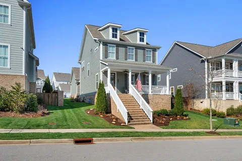 a living room with fireplace furniture and a flat screen tv