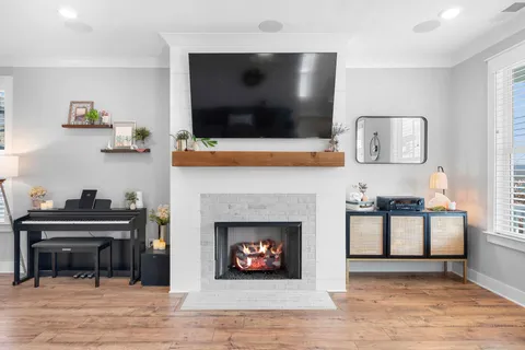 a view of a dining room with furniture window and wooden floor