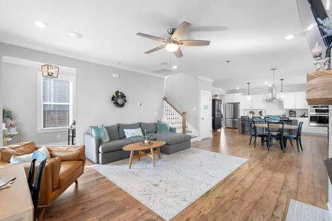 a view of kitchen with refrigerator dining table and chairs