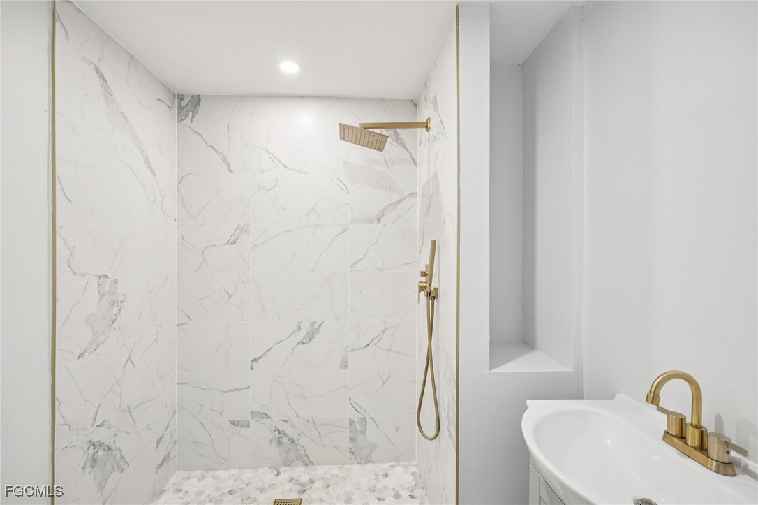 18472 Iris Road Fort Myers, FL 33967 - Photo 12 of 27 a bathroom with a shower