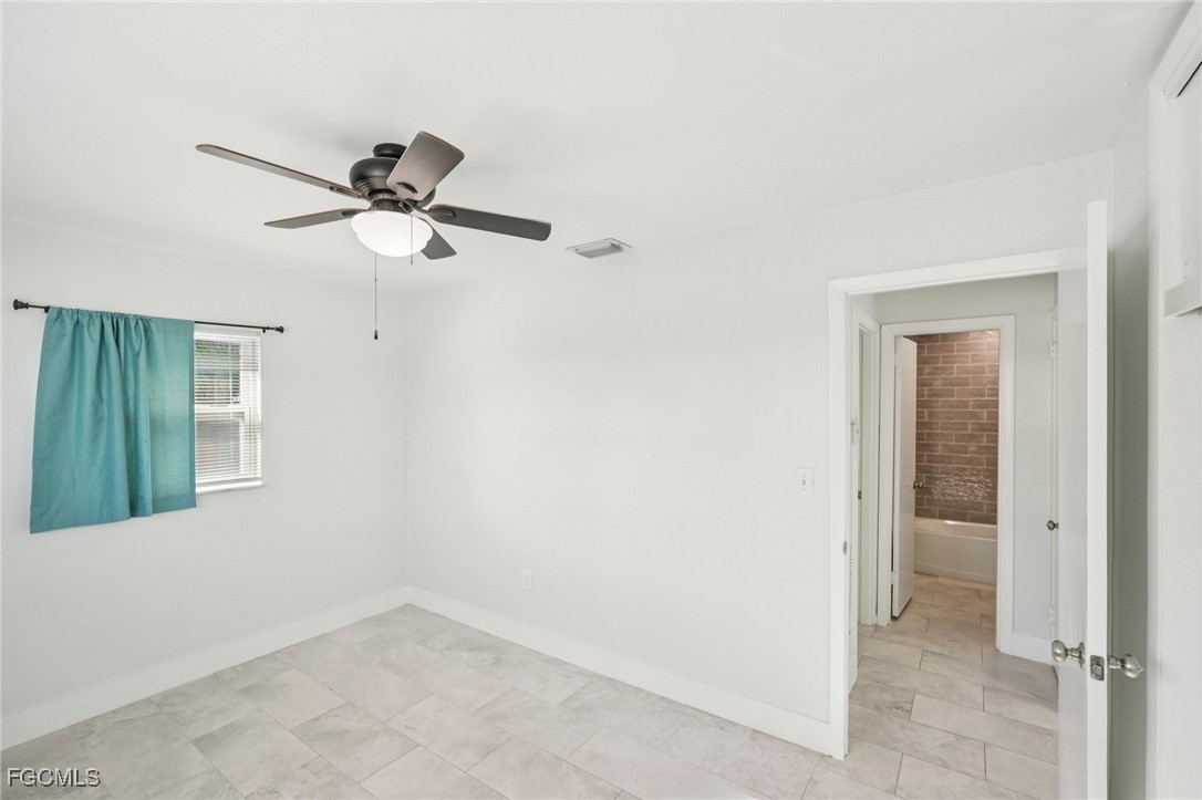 18472 Iris Road Fort Myers, FL 33967 - Photo 15 of 27 a view of a ceiling fan in a room