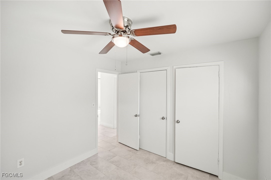 18472 Iris Road Fort Myers, FL 33967 - Photo 17 of 27 a view of a chandelier fan in a room