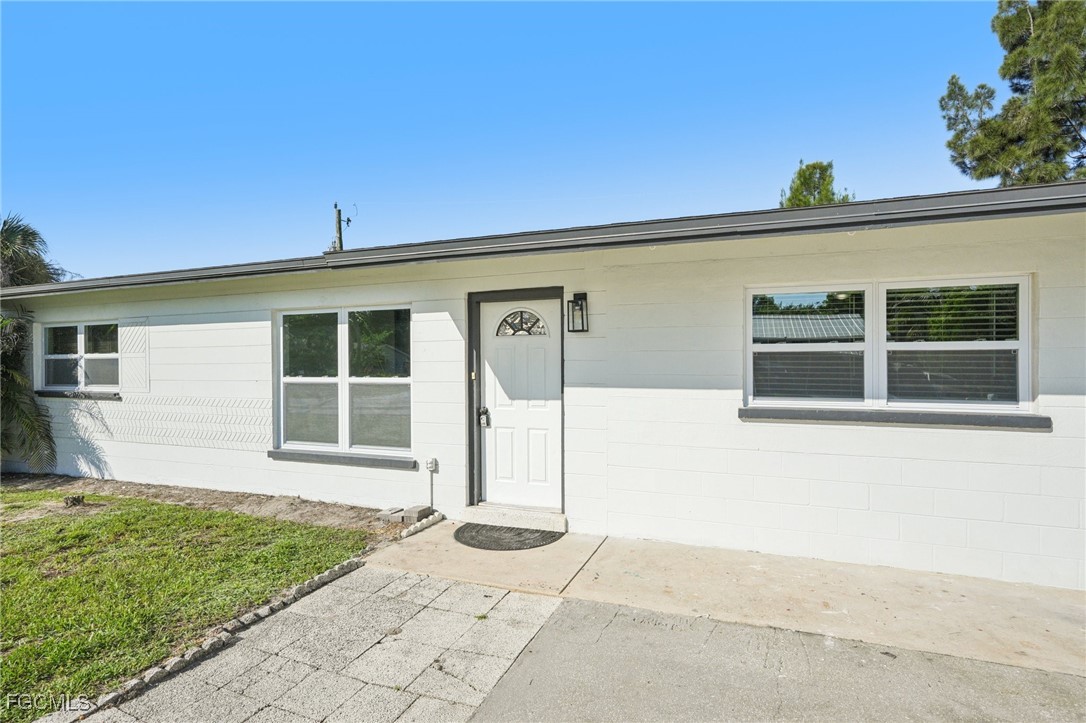 18472 Iris Road Fort Myers, FL 33967 - Photo 2 of 27 a view of a house with a backyard
