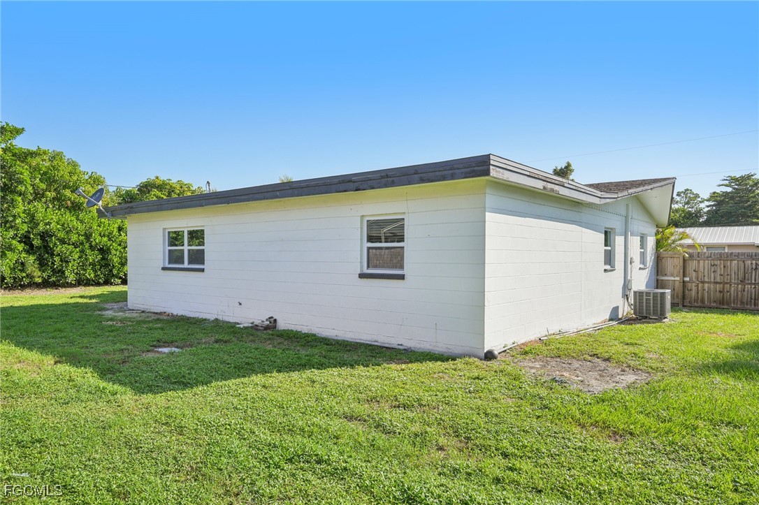 18472 Iris Road Fort Myers, FL 33967 - Photo 26 of 27 a view of a house with backyard and trees