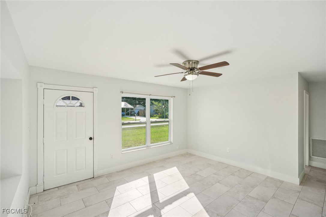 18472 Iris Road Fort Myers, FL 33967 - Photo 3 of 27 a view of an empty room with a window
