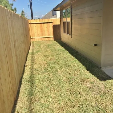 a kitchen with a sink and a stove top oven
