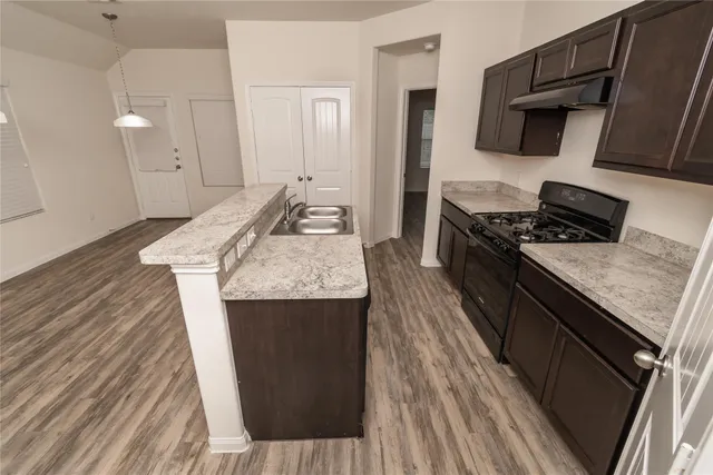a bathroom with a sink toilet and vanity