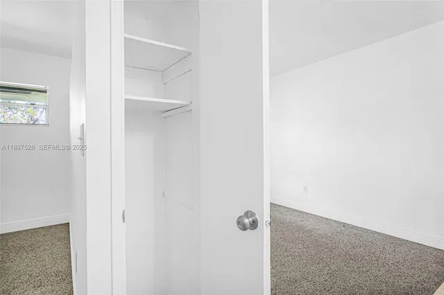 a kitchen with stainless steel appliances white cabinets and a stove