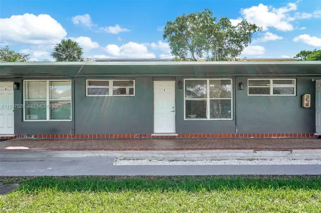 an aerial view of a house with a garden