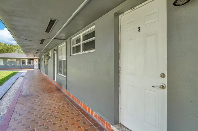 a view of car parked on the side of the road